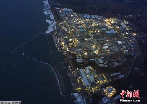 資料圖：3016年3月10日，“3?11”大地震5周年紀(jì)念日的前一天，福島第一核電站在黃昏中停運(yùn)亮燈的場景。